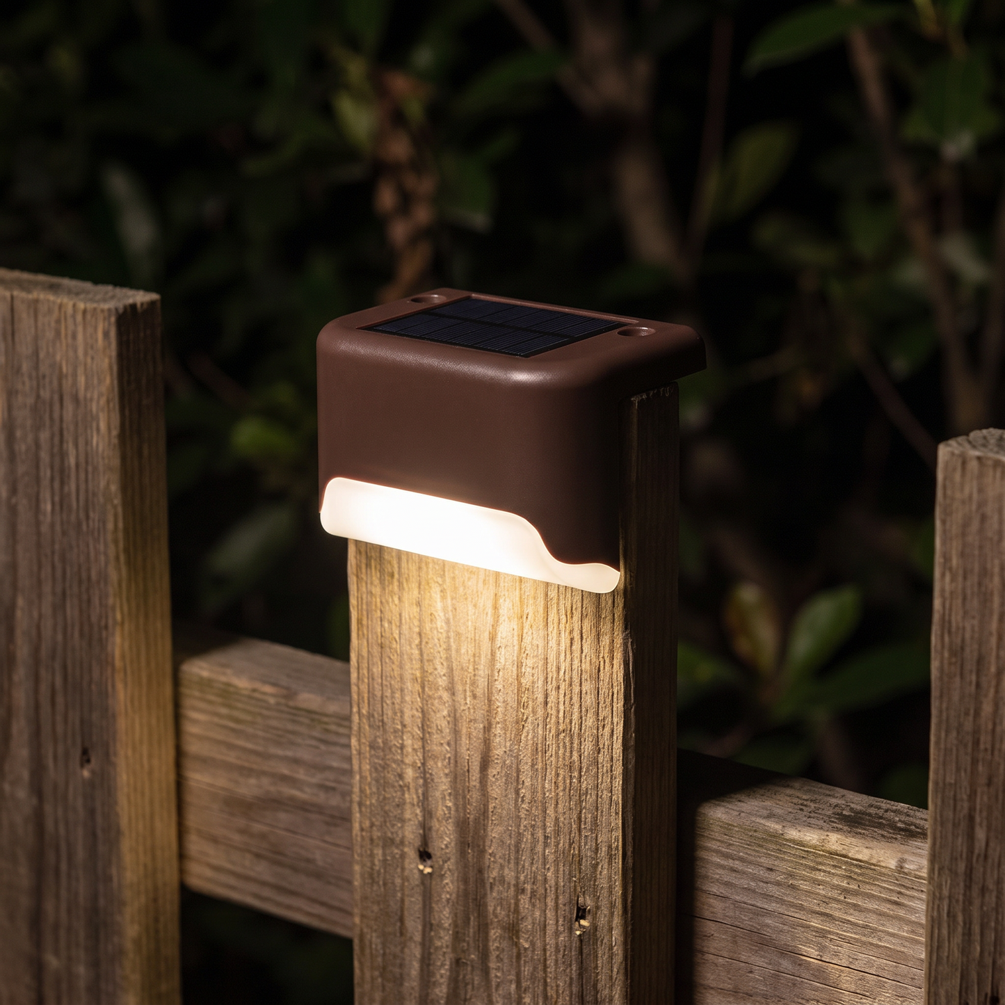 Solar light on a fence post at night