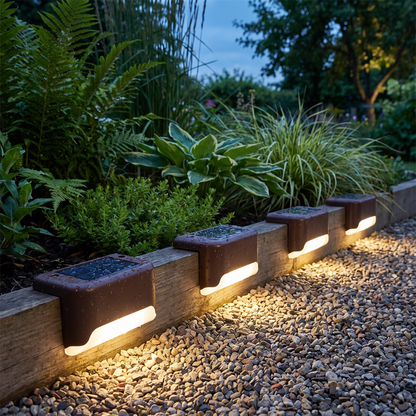 Solar LED lights along a garden path at dusk