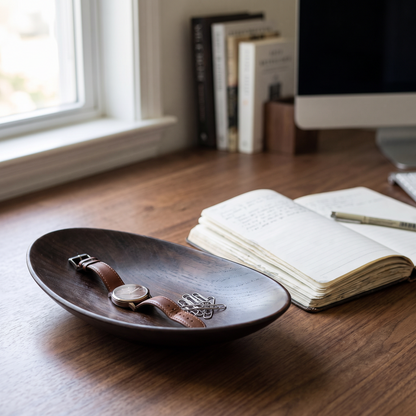 Tray on a desk holding a watch and clips