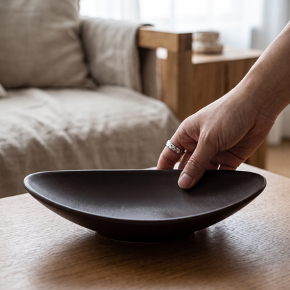Close-up of a hand placing a ring in the tray