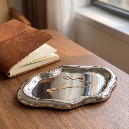 Tray on a desk holding a necklace
