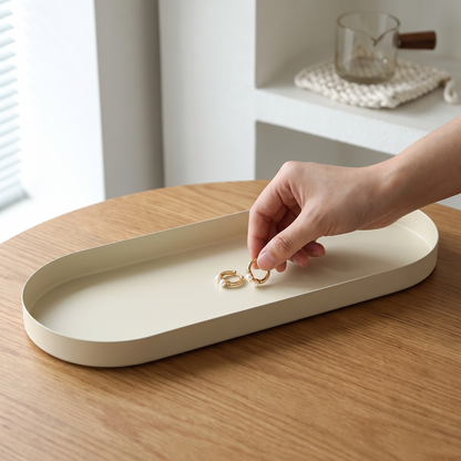 Close-up of earrings being placed in the tray