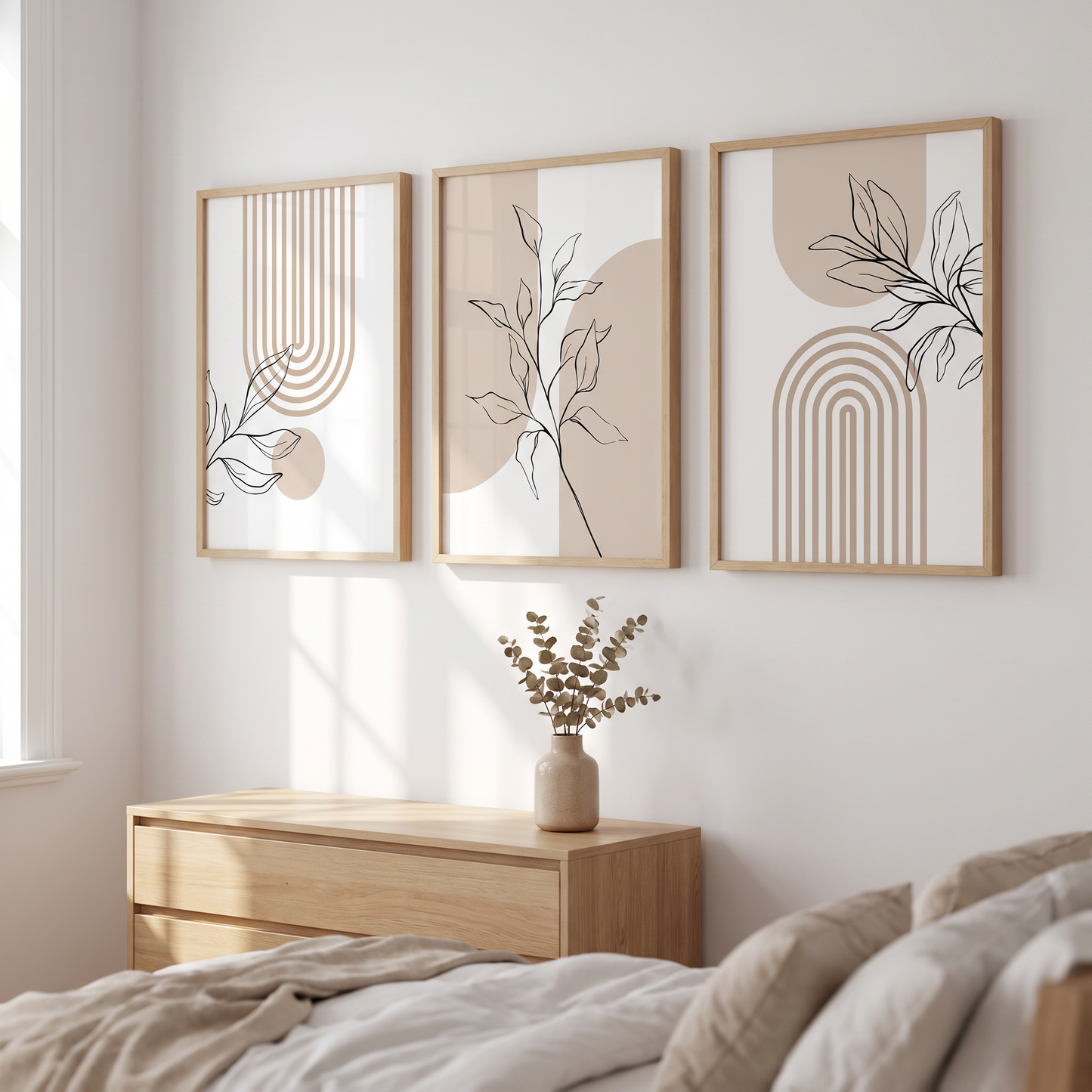 Prints on a bedroom wall above a dresser