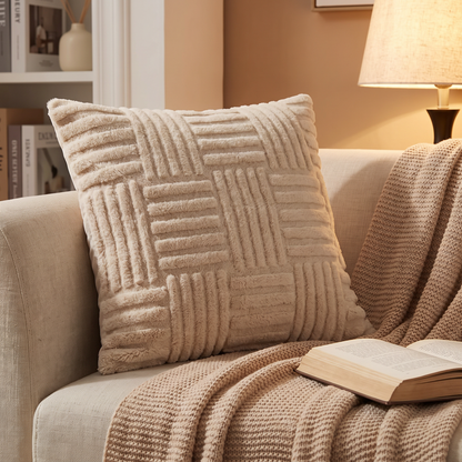 Cushion on a reading chair with a throw